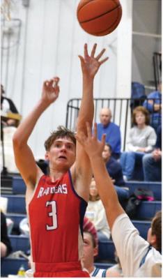 Medicine Valley’s Ethan Brown knocks down a jumper during a Raiders victory.