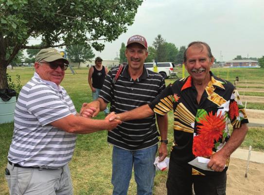 Alan Hooper, Coordinator, with first-place team Terry &amp; Gary White