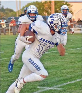 Arapahoe’s Grayson Koller sprints past the defense on a firsthalf touchdown reception.