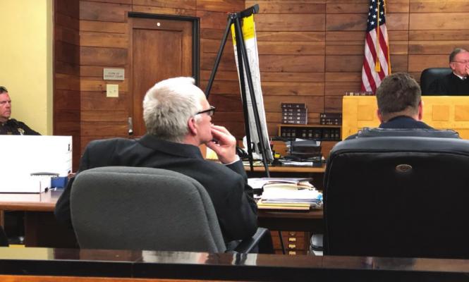 Oxford’s Billy Quinn listens to testimony during his trial in the Furnas County District Court Room in Beaver City.