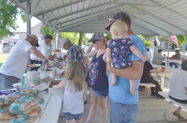 Sons of American Legion hold hamburger feed and ceremony for disposing worn out flags
