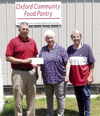 Ag Valley Co-op recently partnered with Land O’Lakes Foundation and made a $5,000 donation to the Oxford Food Pantry. In the photo L to R: Jeff Krejdl, CEO of Ag Valley Co-op, Bev Kindler, Volunteer, and Susan Rhynolds, Volunteer.