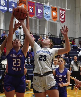 Medicine Valley’s Sienna Houghtelling and Southwest’s Atleigh Nelms battle for a rebound.