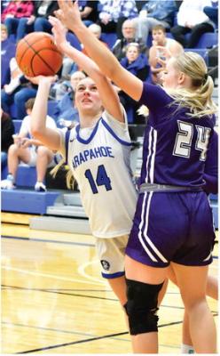 Arapahoe’s Desi Farner tries to score inside against the challenge of Southern Valley’s Brynn Baily.