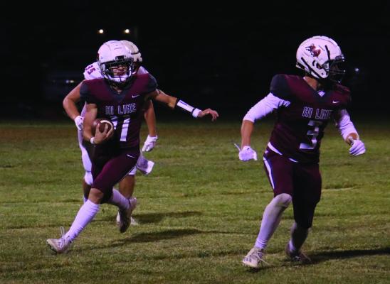 Hi-Line’s Ryker Evans returns a punt for a touchdown.