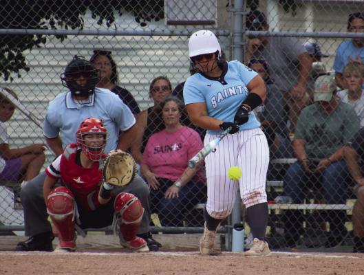 Southern Valley-Alma’s Macy Adams drives a single to left.