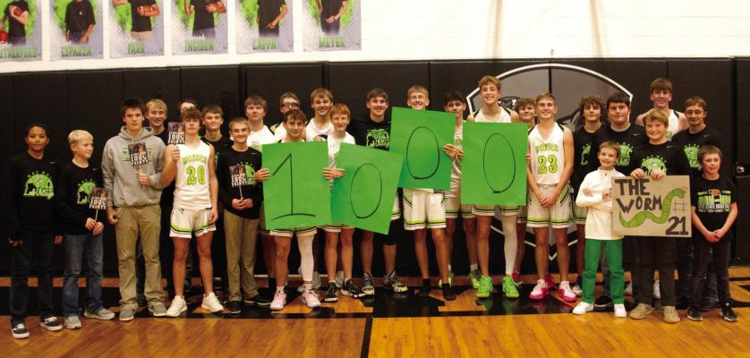 Maywood-Hayes Center team members helped Haydn Farr celebrate reaching 1,000 career points scored.