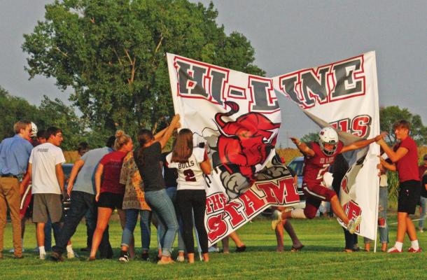 The Hi-Line football team comes running out on Homecoming for Eustis-Farnam.