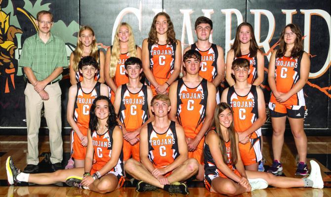 The Cambridge cross country team is pictured above as follows, from left: JoLie Farr, Gavin Gunderson, Rachel Harris; second row: Colton Gross, Braden Sandfort, Jaysek Weiss, Carter Shoemaker; back row: Coach Peter Bogardus, Briar Gunderson, Kylie Koeppen, Jensyn Weiss, Henry Shoemaker, Katie Fegley, Irmina Cramer