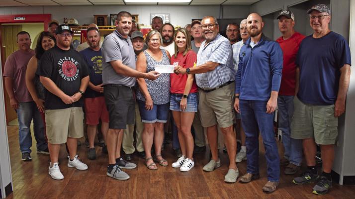 A check for $50,000 was presented by Pep Baldonado, wife Sherri and daughters Sara, Megan and Morgan and BHA representative Wes Edson to the Elwood Fire Dept. at their meeting on September 6th. Also gift certificates for $250 to each of the firemen.