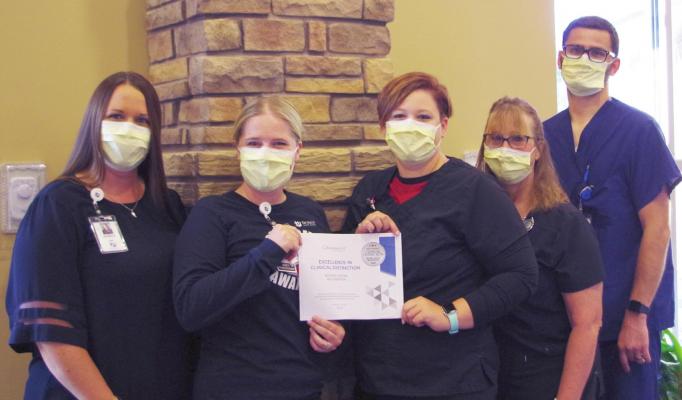 Biannual award acknowledges exceptional success in wound healing rates, safety goals. Pictured with the award are: Jessica Fisher, Chief Executive Officer; Sally Farquhar, APRN; Conchita Einspahr, RN; Kenda Ekdahl, RN; and Clay Jordan, Chief Nursing Officer.