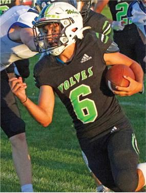 MHC’s Kody Schwenk tossed a pair of touchdowns and ran for another in the Wolves’ loss to Silver Lake.