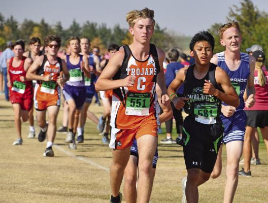 Cambridge’s Gavin Gunderson, MHC’s Rubiel Lopez and Arapahoe’s Lael Rathbun get off to a strong start.