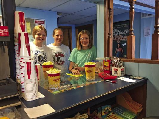Crystal Theater volunteers Cassie Hilker with her daughters Clara (left) and Meg (right).