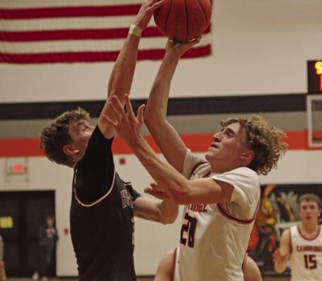 The Bulls’ Hudson Weeder rejects a shot from Cambridge’s Hodge Raburn.
