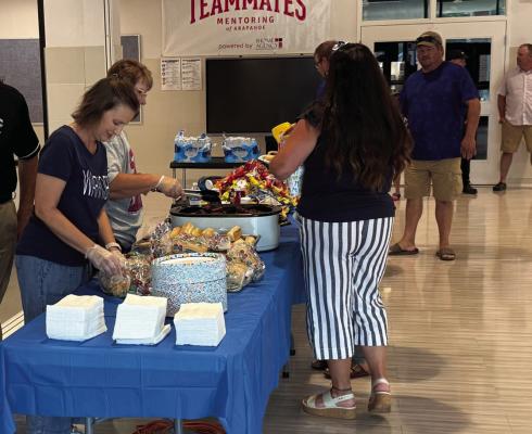 Arapahoe celebrated a return to school with a cookout and open house Monday before the Board of Education meeting.
