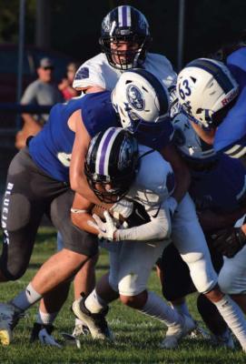Southern Valley’s Braxton Hammond is met at the line of scrimmage.