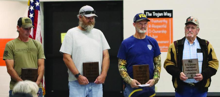 Local veterans honored at the Cambridge Public Schools Veterans Day program are pictured from left: Joel Saylor, Chris Allen, Tim Petersen, RG Brown.