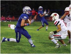 Arapahoe’s Trenton Roskop works in space against Alma.