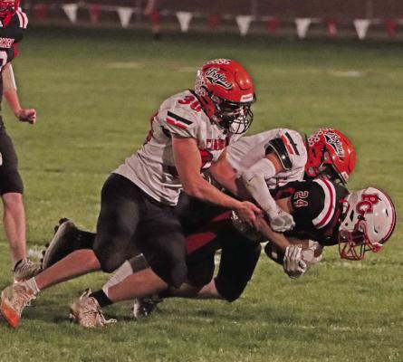 Cambridge’s Hunter Perks and Jayden Ruf combine on a tackle.