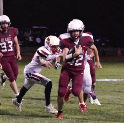 Hi-Line’s Gage Rupp eludes a tackler on a run.