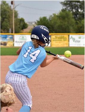 Southern Valley/Alma’s Izzy Dubbs drops down a bunt to bring in a run on a squeeze play against Highway 6.