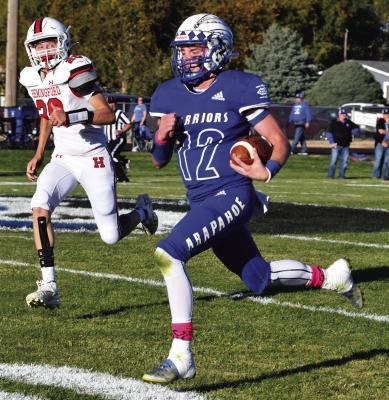 Arapahoe’s Trenton Roskop gets loose on a touchdown run.
