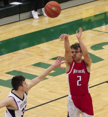The Raiders’ Tyce Pate knocks down a three from the wing.