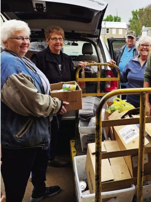 Rural Postal Carriers collected over 400 pounds of food during their Stamp Out Hunger event of Saturday, May 13. The event has rural carriers collecting food along their rural mail routes. The food collected is being donated to the Oxford Community Food Pantry. The Oxford Pantry will soon have a new building to house the pantry and all the donations received. Pictured are Food Pantry volunteers Bev Kindler, Sue Rhynalds, Marv Kinder and postal carrier Val Percival.