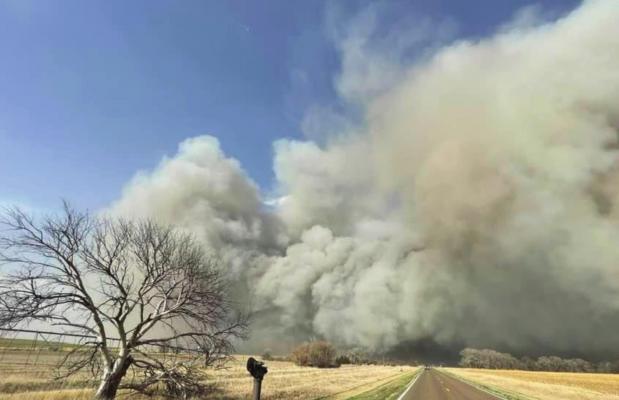 A photo from Cambridge Firefighter Logan Baker shows the massive plume of smoke and dust over Highway 89 west of Wilsonville. The fire started in Kansas and ripped through Furnas and Red Willow counties.