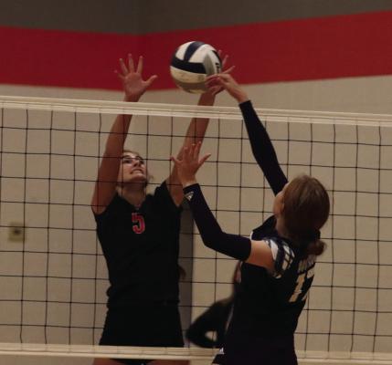 Cambridge’s Jalen Kent rejects the attack of Southwest’s Bryn Lampe.