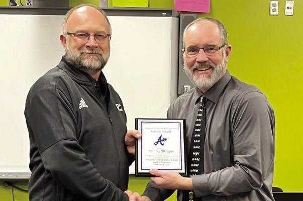 Supt. Bob Drews presented a thank you plaque to outgoing board member Rod Whipple