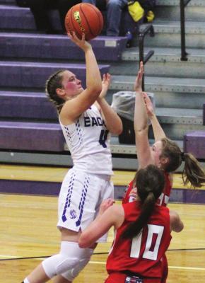 Southern Valley’s Kynlee Marquez rises in the lane for a jumper over a defender.