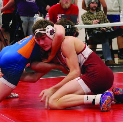 Hi-Line’s Grady Schutz tries for a single-leg.