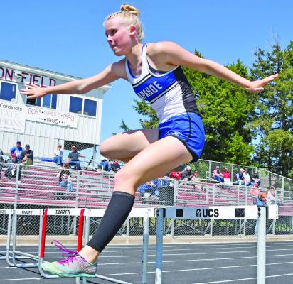 Emma Strand of Arapahoe runs the 300 meter hurdles at the Dale Harsin Invitational at Alma.