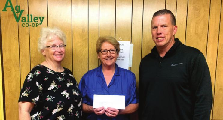 Receiving a donation for the Food Pantry in Oxford (L to R) Beverly Kindler, Susan Reynolds, and Jeff Krejdl, Ag Valley General Manager.