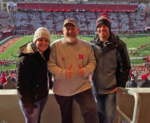 Erin and Logan Baker of Cambridge posed with Larry the Cable Guy following Nebraska’s football contest in Lincoln against Wisconsin November 19.