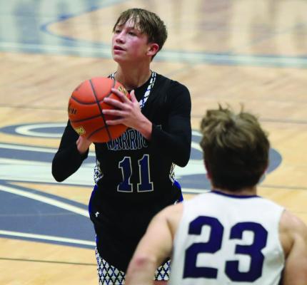 The Warriors’ Chris Hermes launches a three from the wing.