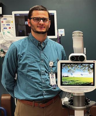 Tri Valley Health System Chief Nursing Officer Clay Jordan is pictured with the telemedicine unit that will allow neurologists from Bryan Health to treat stroke patients at Tri Valley Health System. Treatment for stroke is very time critical and patients can be treated at Tri Valley Health System.