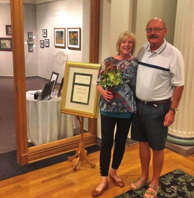 Dee Haussler, a ‘64 graduate of Arapahoe, and his wife, Jerri, have photography and wood carving artwork, pictured right, on display at the Minden Opera House through October.