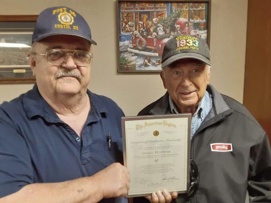 American Legion Corporal Carl Heath Post 95 of Curtis, NE presented 60 year continuous membership certificates to Gerald Huntwork of Stockville, NE. and Allan Anderson of Lincoln. Pictured: Post Adjutant RJ Christensen and Gerald Huntwork.