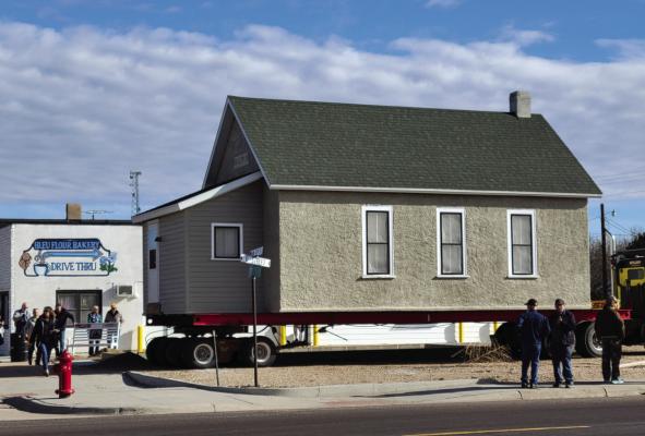 The schoolhouse donated to the Indianola Historical Society arrived at its new location at the corner of Highway 6/34 and Fourth Street Tuesday morning.