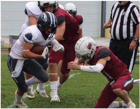 Southern Valley’s Braxton Hammond (above) and Kamden Bose (below) try to fight through traffic in the backfield.