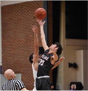 Hi-Line’s Dawson Ruda wins the opening tip against Overton.