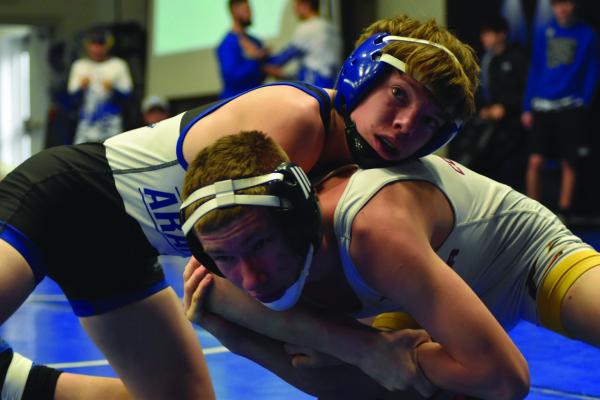 Arapahoe’s Clayton North looks for a takedown.