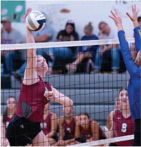 Hi-Line’s Allison Wall attacks from the middle.