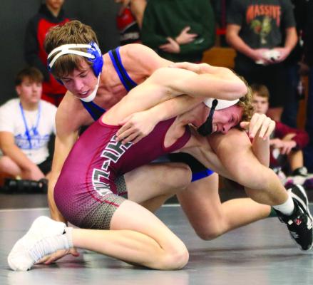 Arapahoe’s Briggs Hill and Hi-Line’s Parker Schutz battle for control.