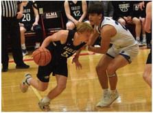 Southern Valley’s Rian Grove dribbles across the key.