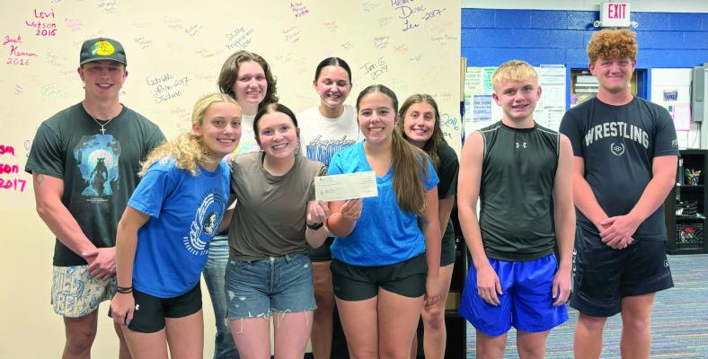 The Arapahoe Deja Blue Choir has received the $25,000 award check from American Endowment Foundation. This money will help fund their trip to Carnegie Hall in May 2025. A few choir members were available to accept the grant.
