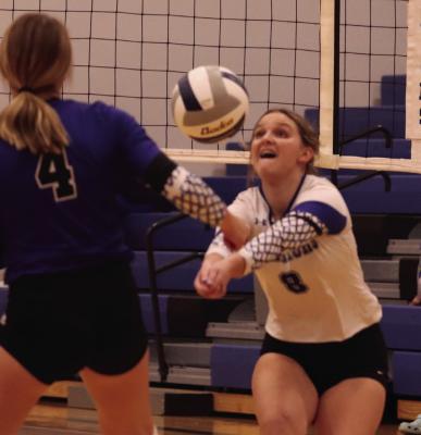 Arapahoe’s Hayden Garey bump-sets a teammate.